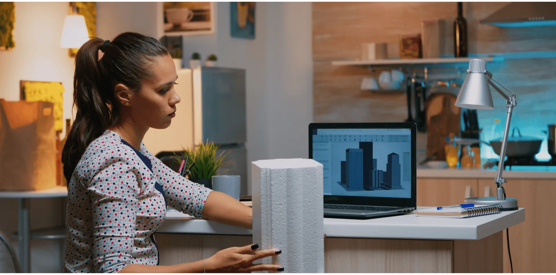 Engineer reviewing a 3D building model on screen